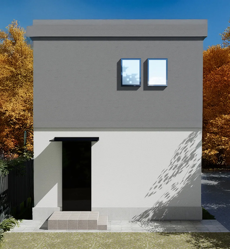 紅葉に囲まれたコンクリート住宅の外観